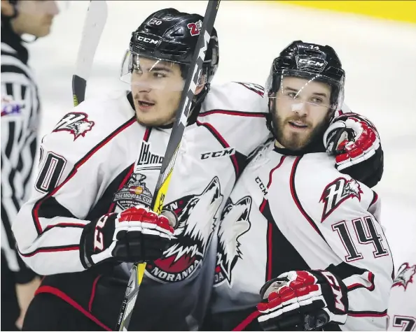  ?? JEFF MCINTOSH/THE CANADIAN PRESS ?? The Rouyn-Noranda Huskies’ Nikolas Brouillard, right, celebrates his goal with Timo Meier during the second period of their Memorial Cup semifinal in Red Deer Friday night. The Huskies downed the Red Deer Rebels 3-1 behind strong goaltendin­g by Chase...