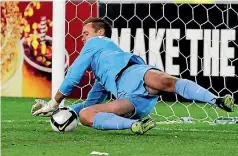  ?? PHOTO: PHOTOSPORT ?? Mark Paston makes the decisive penalty save against Bahrain which helped send New Zealand to the 2010 World Cup finals.