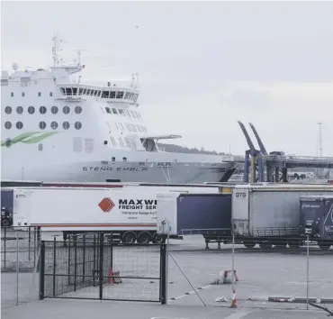  ??  ?? 0 Freight trucks stand alongside a Ferry in Belfast. The port has been at the centre of Brexit tensions