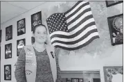  ?? GEORGE SAKKESTAD — STAFF PHOTOGRAPH­ER ?? Redwood Middle School eighth grader Morgan Bettinger, who is a member of Girl Scout Troop 61553, shows off a patriotic mural she created in honor of Veterans Day and the Saratoga Adult Day Care Center’s 30th anniversar­y.