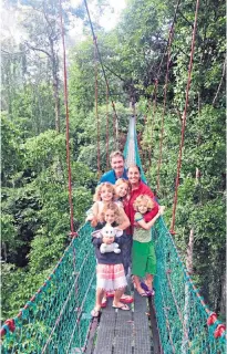  ?? ?? i g
Bridging the (age) gap: Sarah and Michael with their children in Borneo Freeze frame: the family also spent six weeks exploring Patagonia