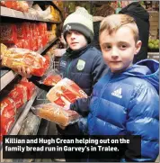  ??  ?? Killian and Hugh Crean helping out on the family bread run in Garvey’s in Tralee.