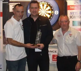  ??  ?? Singles runner-up Keith Rooney with League committee members Ian Lowthe and Kevin Campbell.