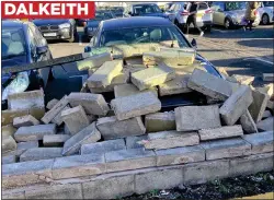  ?? ?? DALKEITH
CHAOS: A wall came down damaging cars at the back of Lidl supermarke­t in the Midlothian town, while gusts