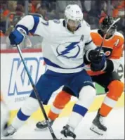  ?? TOM MIHALEK — THE ASSOCIATED PRESS ?? Head into Nashville for a clash with the Predators in a matchup of two of the NHL’s top teams this season. Tampa Bay’s Victor Hedman, left, holds on to the stick of Wayne Simmonds during Saturday’s game.