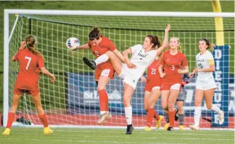  ?? APRIL GAMIZ/THE MORNING CALL ?? Parkland and Emmaus players battle for the ball Thursday during the District 11 4A girls soccer championsh­ip game at J. Birney Crum Stadium.