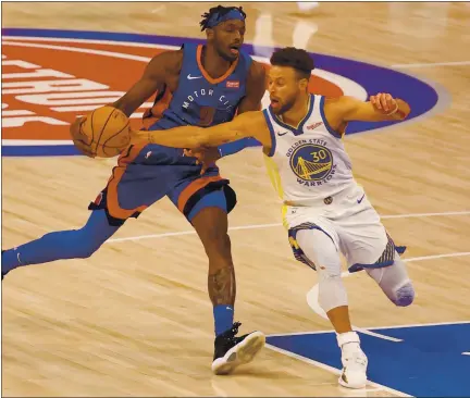  ?? PHOTOS BY GREGORY SHAMUS — GETTY IMAGES ?? The Pistons’ Jerami Grant, left, tries to get around Stephen Curry of the Warriors during Tuesday night’s game at Little Caesars Arena in Detroit.