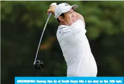 ?? —AFP ?? GREENSBORO: Byeong Hun An of South Korea hits a tee shot on the 18th hole during the second round of the Wyndham Championsh­ip at Sedgefield Country Club.