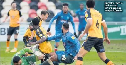  ??  ?? Grimsby Town in their recent fixture against Newport County.