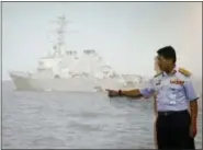  ?? DANIEL CHAN — THE ASSOCIATED PRESS ?? Malaysian Maritime Director Indera Abu Bakar points the damage of USS John S. McCain shown on a screen Monday during a news conference in Putrajaya, Malaysia.