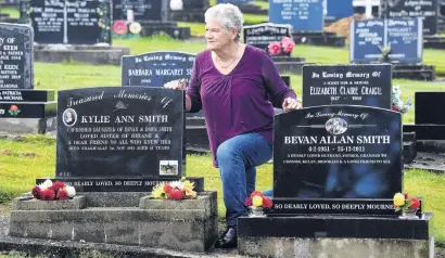  ?? PHOTO: STEPHEN JAQUIERY ?? Decades of pain . . . Dawn Smith was brightenin­g up the graves of her daughter Kylie and husband Bevan at the Owaka Cemetery yesterday.