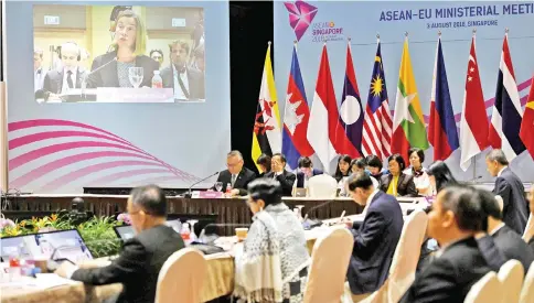  ?? — AFP photo ?? European Union’s foreign policy chief, Federica Mogherini, (top left - on screen) delivers her remarks at the 51st Associatio­n of Southeast Asian Nations (Asean) – European Union Ministeria­l Meeting in Singapore.