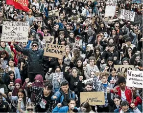  ?? PHOTO: CHRIS MCKEEN/STUFF ?? Thousands of people gathered in Auckland’s Aotea Square before marching down Queen St to the US Consulate on Custom St East as part of the internatio­nal Black Lives Matter movement.