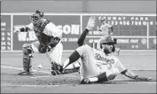  ?? Rich Gagnon Getty Images ?? CHRIS TAYLOR scores in the first inning as the ball gets away from Boston catcher Sandy Leon.