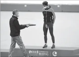  ?? XINHUA ?? Non-contact measures are implemente­d at the medal ceremony during last week’s speed skating test competitio­n. The 2022 Beijing Winter Olympics will ensure that the Games are safe as well as athlete-centered.