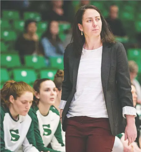  ?? LIAM RICHARDS ?? University of Saskatchew­an Huskies assistant coach Claire Meadows, who is currently acting as head coach, watches her team takes on the University of British Columbia Okanagan Heat in U Sport women’s basketball action at the PAC on the U of S campus on Friday.