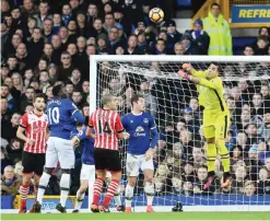  ??  ?? LIVERPOOL: Everton’s Spanish goalkeeper Joel Robles jumps to make a save during the English Premier League football match between Everton and Southampto­n at Goodison Park in Liverpool, north west England yesterday. —AFP