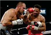  ?? ASSOCIATED PRESS ?? ANDRE WARD (RIGHT) HITS SERGEY KOVALEV during a light heavyweigh­t championsh­ip boxing match Saturday in Las Vegas.