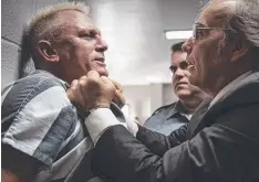  ??  ?? Joe Bang (Daniel Craig) gets roughed up by Dwight Yoakam.