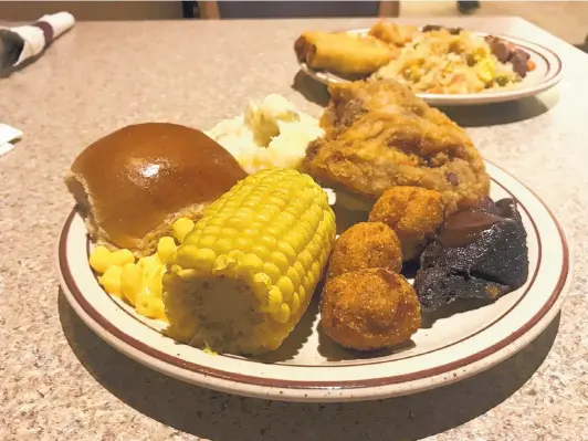  ?? JASON K. WATKINS/FOR THE JOURNAL ?? A sample of food at the Thur Shan Buffet at Sandia Resort and Casino features fried chicken, barbecue pork, smashed potatoes, corn, and mac and cheese, as well as fried rice and egg rolls.