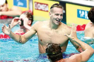  ?? — AFP photo ?? USA's Caeleb Remel Dressel celebrates after winning the men's 100m freestyle final during the swimming competitio­n at the 2017 FINA World Championsh­ips in Budapest, on July 27, 2017.