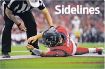  ?? ASSOCIATED PRESS FILE PHOTO ?? Texans quarterbac­k Tom Savage is checked by a referee after he was hit during a Dec. 10 game against the 49ers in Houston. Savage left the game, and it was later determined he had a concussion.