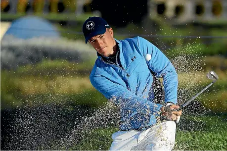  ?? GETTY IMAGES ?? Jordan Spieth plays out of a bunker during the Honda Classic.