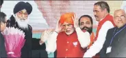  ?? Express ?? Modi, Badal at a rally in Jalandhar on Friday.