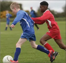  ??  ?? Seán Ojaude of Kilmore United gives chase to Campile United’s Ben Parker in Saturday’s clash.