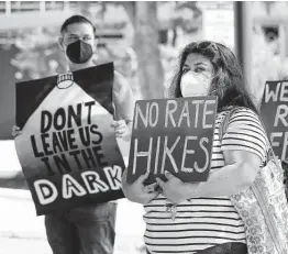  ?? Kin Man Hui / Staff photograph­er ?? Residents protest a proposed CPS Energy rate hike in September. With the trauma of the past 18 months, this is not the time for a rate increase.