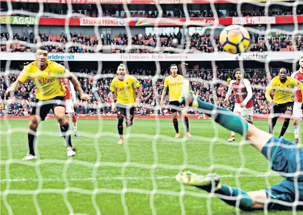  ??  ?? Missed chance: Watford striker Troy Deeney sees his penalty saved by Arsenal goalkeeper Petr Cech