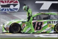  ?? LARRY PAPKE — THE ASSOCIATED PRESS ?? Kyle Busch (18) celebrates after winning a NASCAR Cup Series auto race in Fort Worth, Texas, Sunday.