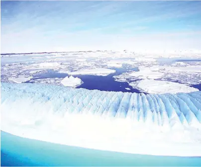  ?? FILE ?? An iceberg oats off the Australian Antarctic territory. Scientists argue that climate change and the depletion of the ozone layer will trigger further melting in the world’s polar regions.