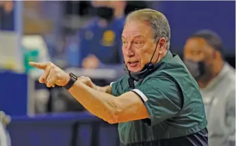  ?? CARLOS OSORIO/AP ?? Head coach Tom Izzo and the Spartans will face UCLA on Thursday in a First Four matchup.