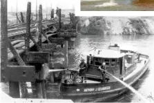  ?? MITCHELL ZAREMBA/CLEVELAND.COM VIA AP ?? Below: Cleveland, Ohio, firefighte­rs extinguish hot spots on a railroad bridge torched by burning fluids and debris on the Cuyahoga River in 1969, in Cleveland.