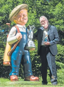  ??  ?? A grand job: Oor Wullie illustrato­r Peter Davidson with Grand Slam Wullie, who will take pride of place at Carnoustie.