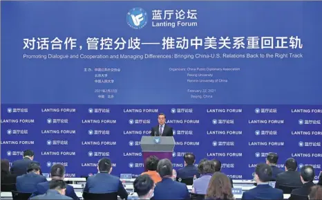  ?? YUE YUEWEI / XINHUA ?? Wang Yi, state councilor and foreign minister, addresses the Lanting Forum in Beijing on Monday. The event is aimed at improving relations between China and the US.