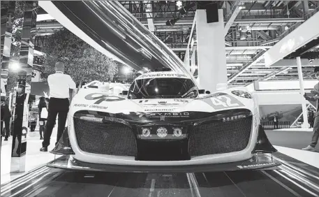  ?? MENG TAO / XINHUA ?? A hydrogen-powered race car is displayed during the fourth China Internatio­nal Import Expo in Shanghai in November.