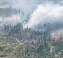  ?? DARRYL DYCK/THE CANADIAN PRESS ?? The Shovel Lake wildfire burns near the Nadleh Whut’en First Nation in Fort Fraser, B.C. There have been 2,011 fires so far this summer, up from last year’s 1,353.