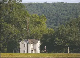  ??  ?? Cappelloni runs through Wyoming, Pa., during his seventh ultramarat­hon in seven days.