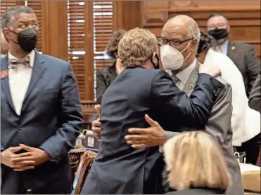  ?? AP-Ben Gray ?? Rep. Bert Reeves (R-Marietta), left, hugs Rep. Calvin Smyre (D-Columbus) after the passage of HB 479, which would reform citizen arrest laws, Monday evening, March 8, 2021.