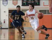  ?? OWEN MCCUE - MEDIANEWS GROUP ?? Perkiomen Valley’s Ethan Kohler (11) drives to the basket as Wissahicko­n’s Matt Compas (30) defends Saturday.