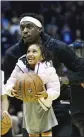  ?? RYAN SUN — THE DESERET NEWS VIA AP ?? Raptors forward Pascal Siakam lifts up a child during practice for the NBA All-Star Game on Saturday.