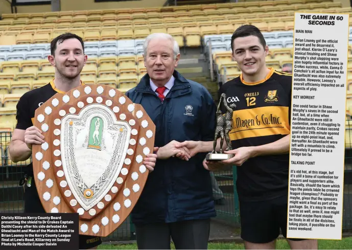  ??  ?? Christy Killeen Kerry County Board presenting the shield to Dr Crokes Captain Daithi Casey after his side defeated An Ghealtacht and Man of the Match Award to Brian Looney in the Kerry County League final at Lewis Road, Killarney on Sunday Photo by...