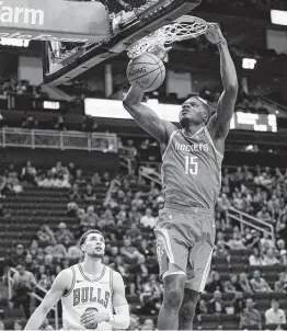  ?? David J. Phillip / Associated Press ?? The Rockets’ Clint Capela dunks on his way to 18 points on 7-for-11 field-goal shooting. He added 15 rebounds in nearly 33 minutes.