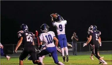  ?? BILL RUDICK — DIGITAL FIRST MEDIA ?? Jose Rodriguez goes up to catch a 6-yard touchdown pass for Kennett against Octorara on Friday.