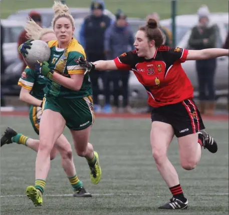  ??  ?? Emma White of St Patrick’s Stamullen, scorer of Meath’s second goal, takes on Down’s Aoibheann McCarville.