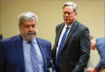  ?? STEVE SCHAEFER / SPECIAL TO THE AJC ?? Robert “Chip” Olsen leaves the courtroom Monday after listening to a GBI interview jurors requested to watch again during his trial at the DeKalb County Courthouse.