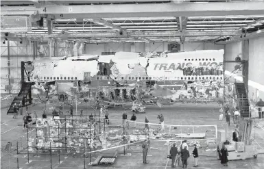  ?? VIC DELUCIA/THE NEWYORKTIM­ES ?? Wreckage recovered from TWAFlight 800 is assembled inside a hangar July 11, 1997, in Calverton, NewYork. The National Transporta­tion Safety Board has announced plans to decommissi­on and destroy the remaining wreckage.