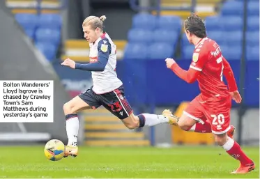  ??  ?? Bolton Wanderers’ Lloyd Isgrove is chased by Crawley Town’s Sam Matthews during yesterday’s game